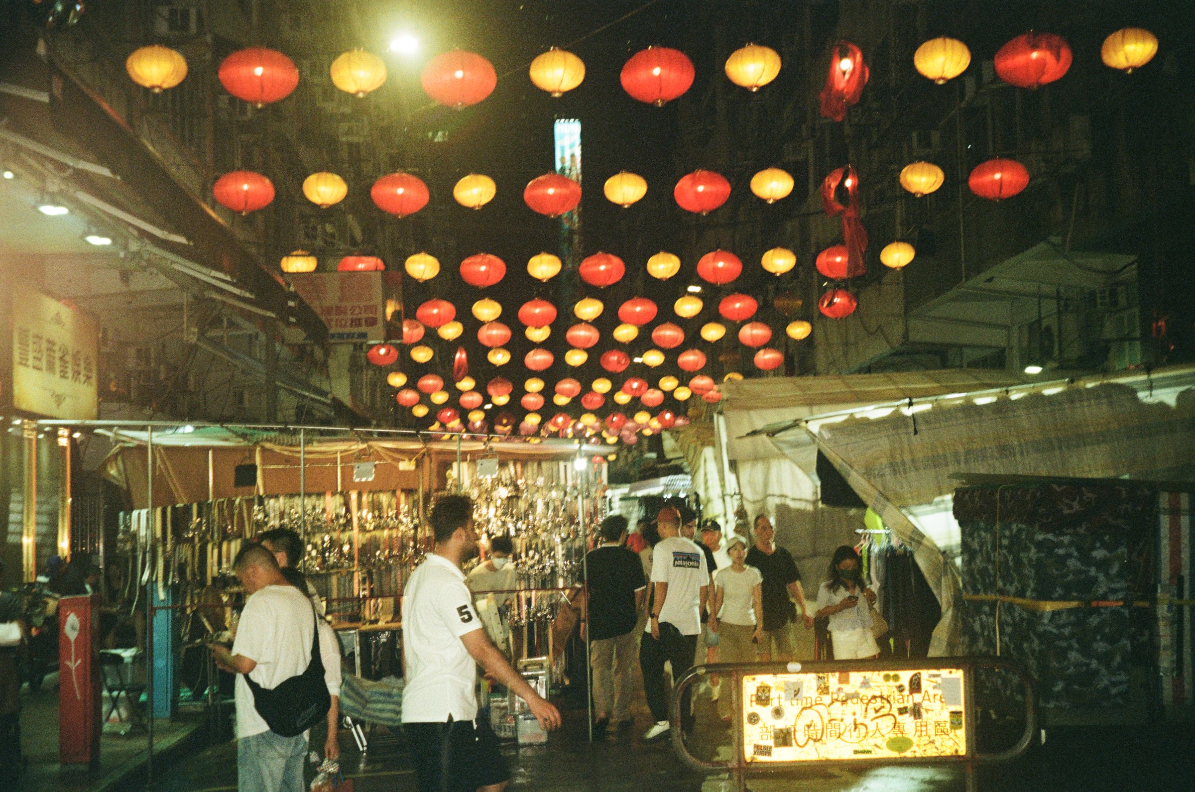 Rows of lanterns above a night market